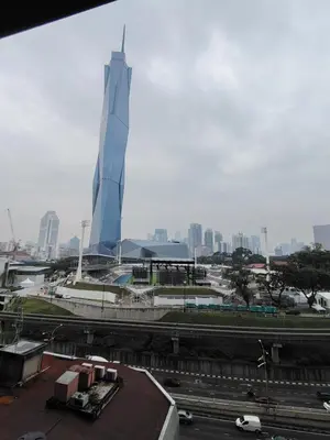 a view of a city with a tall building at First World Suite At Opus Residence KL 118 in Kuala Lumpur