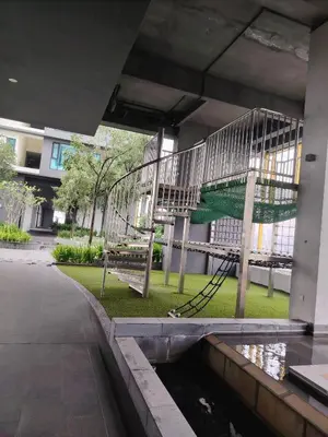 a playground in a building with a slide at First World Suite At Opus Residence KL 118 in Kuala Lumpur