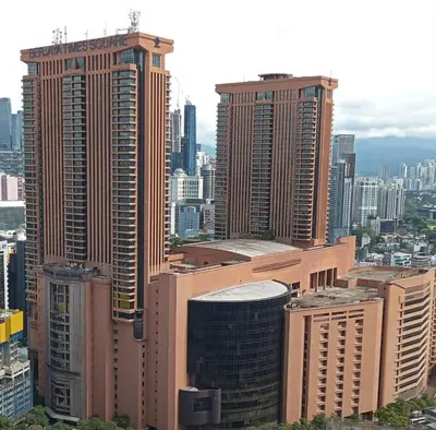 a group of tall buildings in a city at BTS apartment at times square in Kuala Lumpur