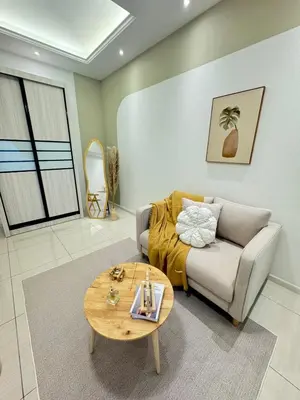a living room with a couch and a table at Dorsett Hartamas with Rooftop Pool and Bathtub in KL City #215 in Kuala Lumpur