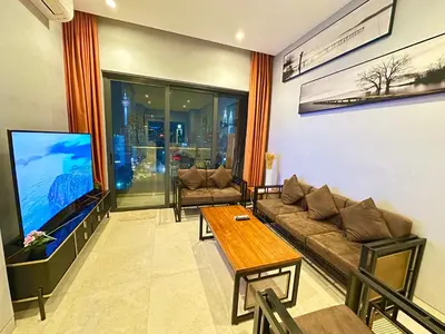 a living room with a couch and a tv at Lucentia Premium stay Kuala Lumpur in Kuala Lumpur