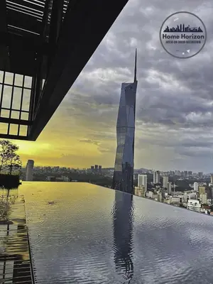 a view of a skyscraper in the middle of the water at Lucentia Premium stay Kuala Lumpur in Kuala Lumpur