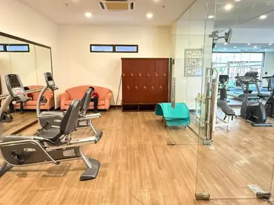 a gym with treadmills and exercise equipment in a room at Residential Family Apartments At Times Square KL in Kuala Lumpur