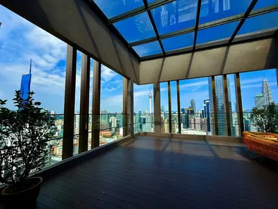 a balcony with a view of the city at Axon Residence KLCC By Premium Suite in Kuala Lumpur