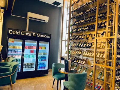 a wine store with a shelf of wine bottles at Aurora Suites At Star Residences in Kuala Lumpur