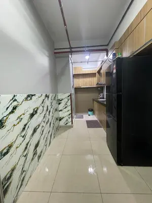 a kitchen with a fish mural on the wall at Nour Homestay KLCC View - COMFORT in Kuala Lumpur