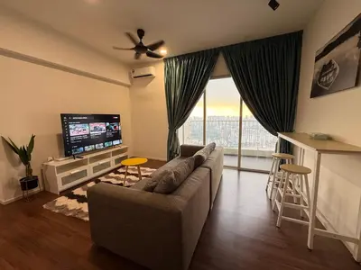 a living room with a couch and a flat screen tv at UNA Residence Maluri MRT Velocity TRX Bkt Bintang in Kuala Lumpur
