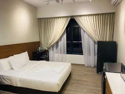 a bedroom with a white bed and a window at agile residence at gorgeous luxury in Kuala Lumpur