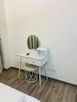 a desk with a mirror and a chair in a room at agile residence at gorgeous luxury in Kuala Lumpur