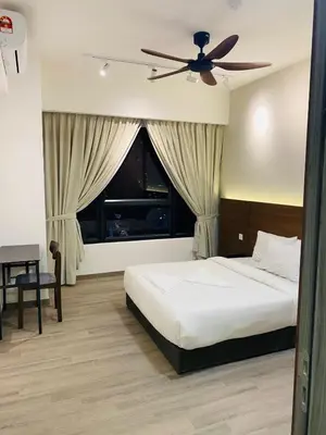 a bedroom with a bed and a ceiling fan at agile residence at gorgeous luxury in Kuala Lumpur