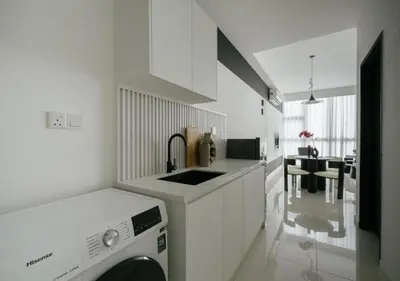 a white kitchen with a sink and a dishwasher at Cool Cityscape Homestay in KL City Center 1-5pax in Kuala Lumpur