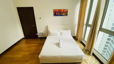 a hotel room with two beds with white sheets at Regalia skypool8 in Kuala Lumpur
