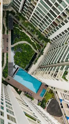 an overhead view of two tall buildings with a pool at Regalia skypool8 in Kuala Lumpur