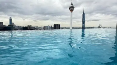 a swimming pool with a view of the city at The Platinum KLCC By Pool Point in Kuala Lumpur