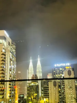 a view of a city skyline from a window at Majestic Residence klcc by Stay Suites in Kuala Lumpur