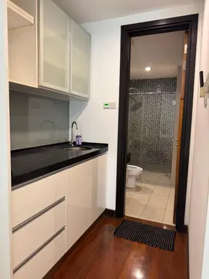 a kitchen with a sink and a bathroom with a toilet at Casa Bukit Bintang By Eryan Guest House in Kuala Lumpur
