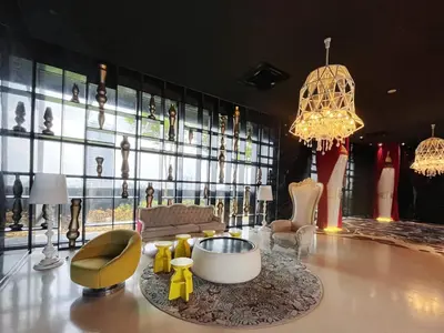 a living room filled with furniture and a large window at Arte Mont Kiara By Whitedoorz in Kuala Lumpur