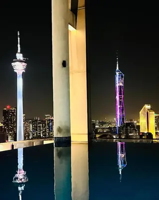 a view of the space needle at night at LUXE KLCC SKY LiNE in Kuala Lumpur