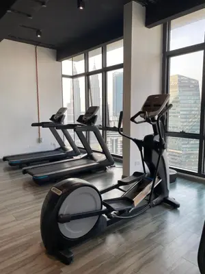 a gym with treadmills and elliptical machines at The MANOR INFINITY Suites KLCC in Kuala Lumpur