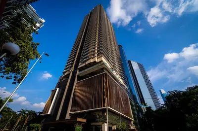 a tall building in a city with a blue sky at The MANOR INFINITY Suites KLCC in Kuala Lumpur