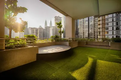 a balcony with a view of a city skyline at The MANOR INFINITY Suites KLCC in Kuala Lumpur