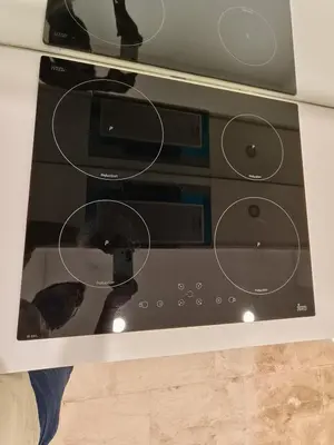 a microwave oven with a cat sitting inside of it at Sky Suites KLCC by Tareen Haven suites in Kuala Lumpur