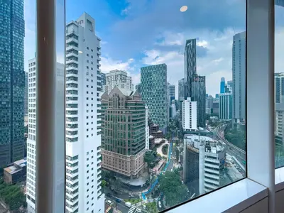 a view of a city skyline from a skyscraper at VORTEX SUITES KLCC By HOMESTAY in Kuala Lumpur