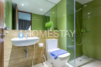 a bathroom with a toilet and a sink and a shower at VORTEX SUITES KLCC By HOMESTAY in Kuala Lumpur
