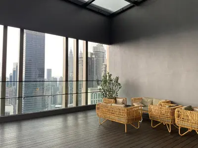 a living room with a view of a city skyline at IKON SUITE's A X O N BUKIT BINTANG in Kuala Lumpur
