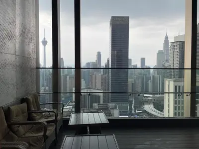 a room with a view of a city skyline at IKON SUITE's A X O N BUKIT BINTANG in Kuala Lumpur