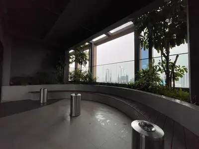 a building with a walkway with a view of the city at IKON SUITE's A X O N BUKIT BINTANG in Kuala Lumpur