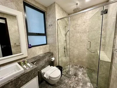 a bathroom with a shower and a toilet and a sink at KLCC City View luxury Suites in Kuala Lumpur