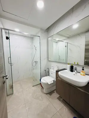a bathroom with a toilet and a sink and a shower at Agile Bukit Bintang TRX By Empire Suites in Kuala Lumpur