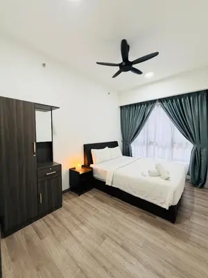 a bedroom with a bed and a ceiling fan at Agile Bukit Bintang TRX By Empire Suites in Kuala Lumpur