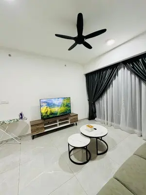 a living room with a couch and a ceiling fan at Agile Bukit Bintang TRX By Empire Suites in Kuala Lumpur