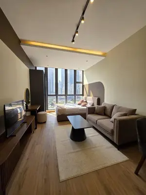 a living room with a couch and a tv at Sky Line Suites KL Podu in Kuala Lumpur