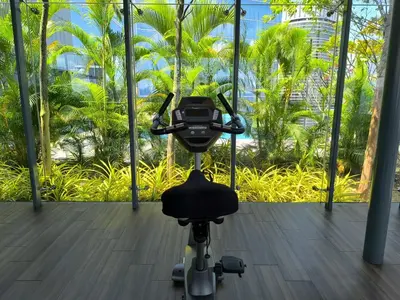 a camera on a tripod in a room with palm trees at The Dorsett Bukit Bintang KL in Kuala Lumpur