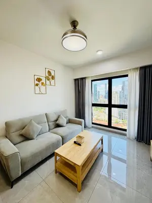 a living room with a couch and a coffee table at Agile Bukit Bintang TRX By RUP Suites in Kuala Lumpur