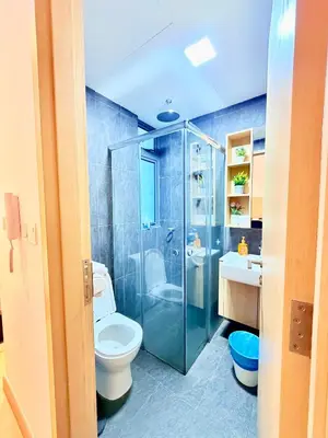 a bathroom with a toilet and a shower and a sink at The luxe by Kuala Lampur City in Kuala Lumpur