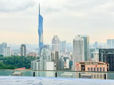 a view of a city skyline with skyscrapers at The luxe by Kuala Lampur City in Kuala Lumpur