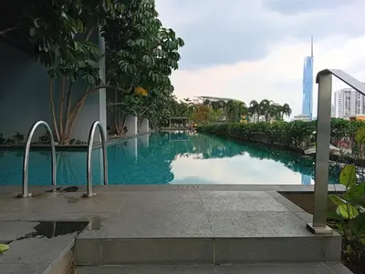 a swimming pool with a view of the skyscrapers at Sky Residence at TRION KL in Kuala Lumpur