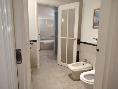 a bathroom with a toilet and a sink at Time square midnight suites KL in Kuala Lumpur