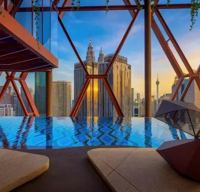 a swimming pool with a view of the city at Alion Sutis KLCC At Scarlets in Kuala Lumpur