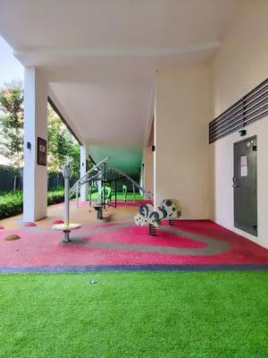 a room with a gym with playground equipment and grass at Rooftop Pool At Majestic Residence in Kuala Lumpur