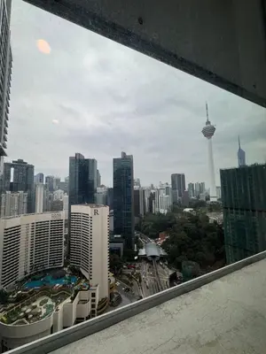 a view of a city skyline from a window at Oras Suites At platinum KLCC in Kuala Lumpur