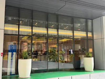 a building with two large pots of plants in it at KLCC VIEW RESIDENC, I M P E R I A L , By LUXORA in Kuala Lumpur