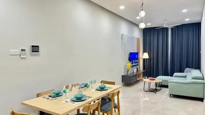 a living room with a table and a couch at Dreamy KLCC Luxury Haven in Kuala Lumpur