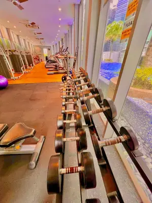 a row of dumbbells lined up in a gym at Vortex in Kuala Lumpur