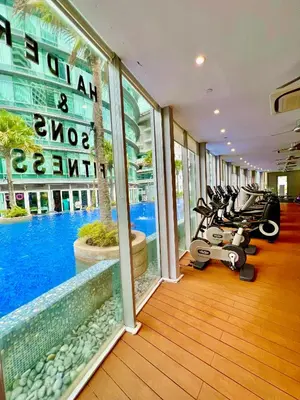 a hotel room with a swimming pool and a gym at Vortex in Kuala Lumpur