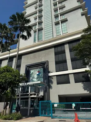 a building with a painting of an eye on it at Bukit Bintang Casa By Eryan Guest House in Kuala Lumpur